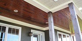 E-Peck Cypress in Auburn Color exterior patio wood ceiling. Rich coloring and natural pecky look!